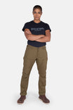 Anna Ultralight Trail Pant in Kelp Green Ripstop by Dovetail Workwear, worn by a woman with arms crossed, featuring reinforced knees and straight leg fit