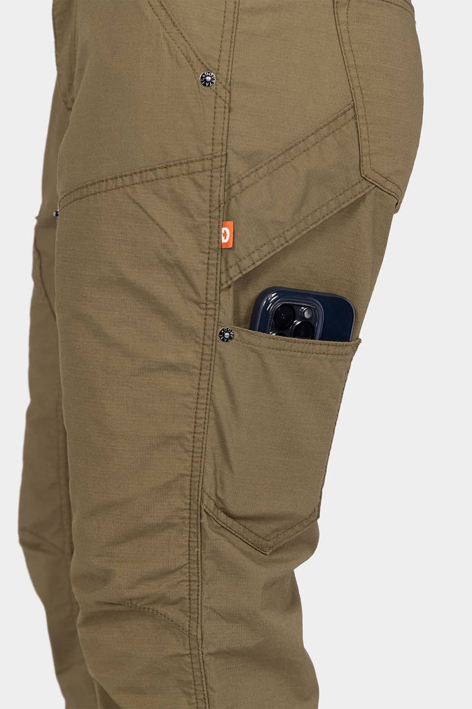 Detail shot of the Anna Ultralight Trail Pant in Kelp Green Ripstop by Dovetail Workwear, displaying a cargo pocket with a smartphone and nested pocket design