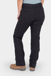 Back view of a woman wearing Dovetail Workwear's Britt Utility Pant in No Fade Black Canvas, featuring nested pockets, tool loop, and reinforced knees