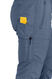 Side view of the Christa X DIY COOLSWAP™ Pant in Dovetail Blue, showing multiple pockets including a yellow item in the upper pocket and tool loop detail