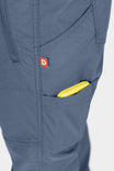 Detail shot of the Christa X DIY COOLSWAP™ Pant by Dovetail Workwear in Dovetail Blue, highlighting the phone pocket and logo label on the thigh