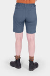 Back view of a woman wearing Dovetail Workwear's Compass COOLSWAP™ Cargo Short in Dovetail Blue, highlighting the bellowed zip cargo pockets and EZWaist™ waistband