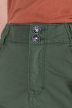Close-up detail of the Compass COOLSWAP™ Cargo Skort waistband in Aventurine Green, showing EZWaist™ branded buttons and reinforced stitching