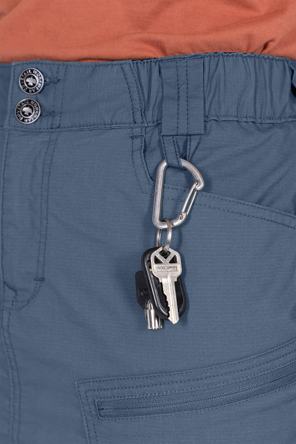 Close-up detail of the Dovetail Blue Compass COOLSWAP™ Cargo Skort's phone pocket