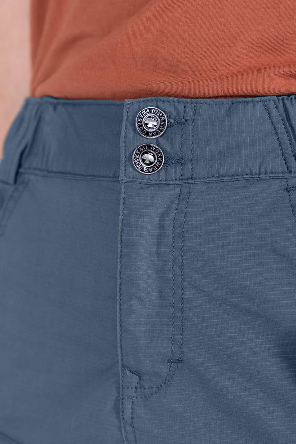 Close-up detail of the waistband on the Dovetail Blue Compass COOLSWAP™ Cargo Skort by Dovetail Workwear, showing the EZWaist™ stretch waistband with double buttons