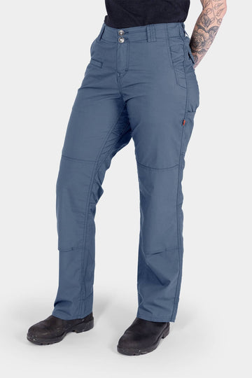 Dovetail Workwear Day X COOLSWAP™ Pant in Dovetail Blue worn by a woman, showcasing the relaxed straight leg fit, reinforced knee with kneepad slot, and functional pockets designed for work and outdoor activities