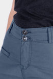 Detail shot of the Day X COOLSWAP™ Pant in Dovetail Blue by Dovetail Workwear, showing the double button EZWaist™ stretch waistband and reinforced front pocket on a woman wearing a black top