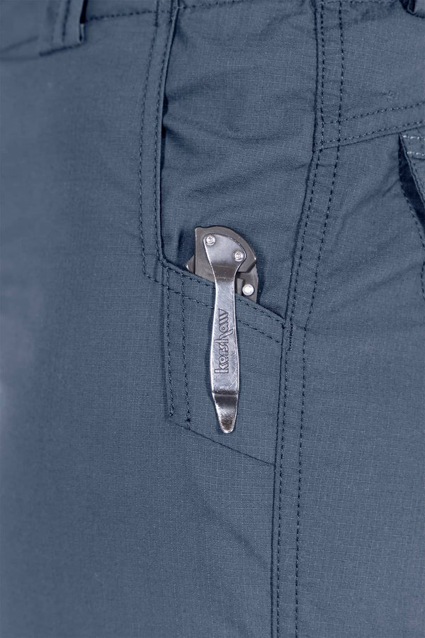 Detail shot of the snap closure back pocket on the Day X COOLSWAP™ Pant in Dovetail Blue by Dovetail Workwear