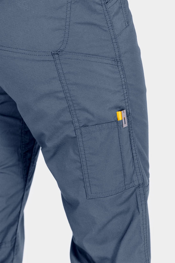 Detail shot of the Day X COOLSWAP™ Pant in Dovetail Blue by Dovetail Workwear, highlighting the functional side pocket and reinforced stitching on the thigh