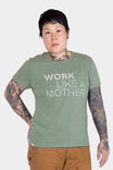 Dovetail Workwear GO TO™ "Work Like a Mother" Graphic Work Tee in sage green, worn by a woman with visible arm tattoos and brown pants