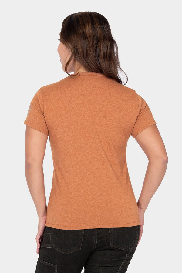 Back view of a woman wearing the Dovetail Workwear GO TO™ Crew Neck Tee Shirt in Faded Paprika Orange with short sleeves and relaxed fit
