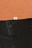 Detail view of the Dovetail Workwear GO TO™ Crew Neck Tee in Faded Paprika Orange and Black, showing the cotton jersey blend fabric and relaxed fit