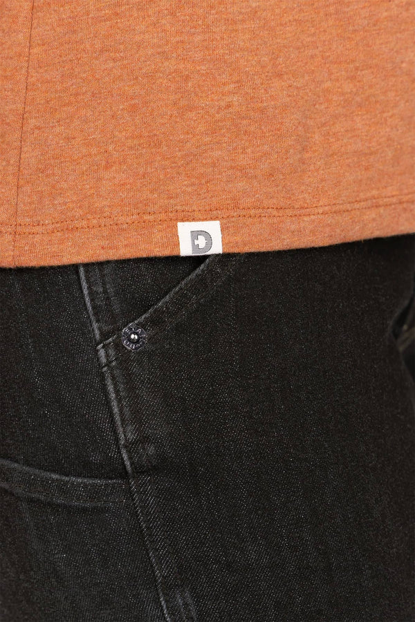 Detail view of the Dovetail Workwear GO TO™ Crew Neck Tee in Faded Paprika Orange and Black, showing the cotton jersey blend fabric and relaxed fit