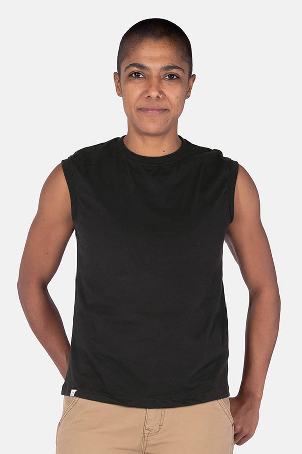 Black GO TO™ Tank Top by Dovetail Workwear with relaxed fit and perfect armhole coverage, worn by a woman with one hand in pocket