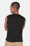 Back view of a woman wearing the Dovetail Workwear GO TO™ Tank Top in Black, showing the relaxed fit and perfect armhole coverage