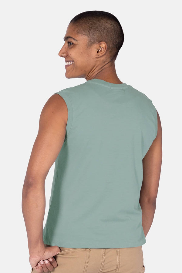 Back view of a woman wearing the Dovetail Workwear GO TO™ Tank Top in Patina Green, showcasing the relaxed fit and perfect armhole coverage