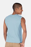 Back view of a woman wearing the Dovetail Workwear GO TO™ Tank Top in Shore Blue, showcasing the relaxed fit and perfect armhole coverage