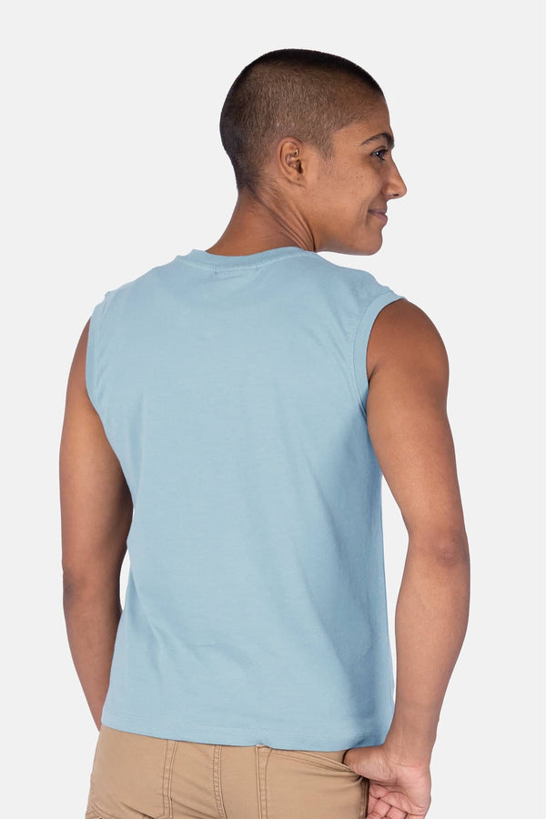 Back view of a woman wearing the Dovetail Workwear GO TO™ Tank Top in Shore Blue, showcasing the relaxed fit and perfect armhole coverage
