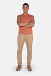Terracotta GO TO™ Tank Top by Dovetail Workwear worn by a woman with arms crossed, paired with khaki work pants and boots