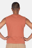 Back view of a woman wearing the Dovetail Workwear GO TO™ Tank Top in Terracotta, showing the relaxed fit and perfect armhole coverage