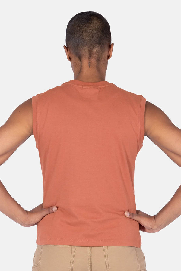 Back view of a woman wearing the Dovetail Workwear GO TO™ Tank Top in Terracotta, showing the relaxed fit and perfect armhole coverage