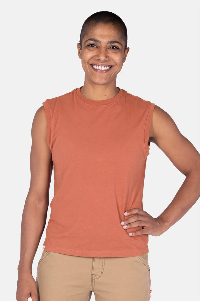 Dovetail Workwear GO TO™ Tank Top in Terracotta worn by a woman, showcasing the relaxed fit, perfect neckline coverage, and soft 100% ring-spun cotton construction