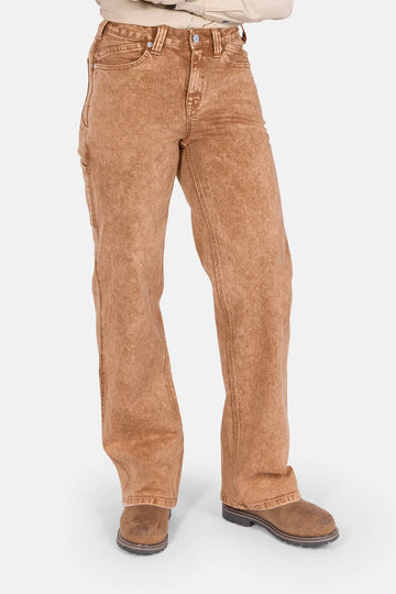 Old School Wide Leg Mineral Wash Jeans in Sunbaked Copper by Dovetail Workwear displayed on a woman, showcasing the high-rise fit, wide leg silhouette, and vintage-inspired design paired with brown boots