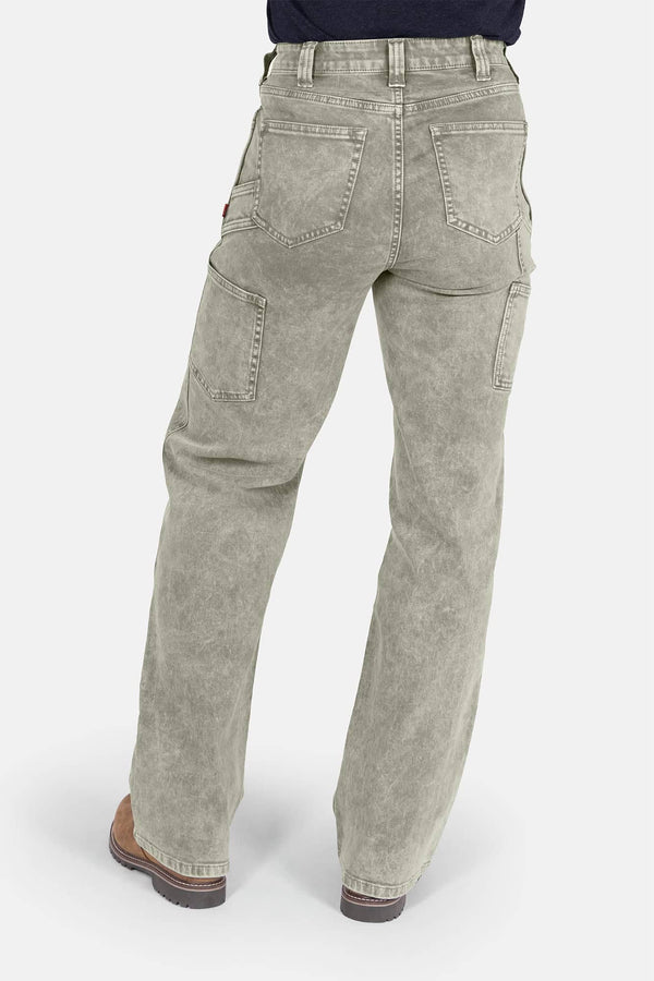 Back view of a woman wearing Dovetail Workwear Old School Wide Leg Mineral Wash Jeans in Sunbaked Eucalyptus, showcasing the high-rise fit, oversized back pockets, and nested side pockets