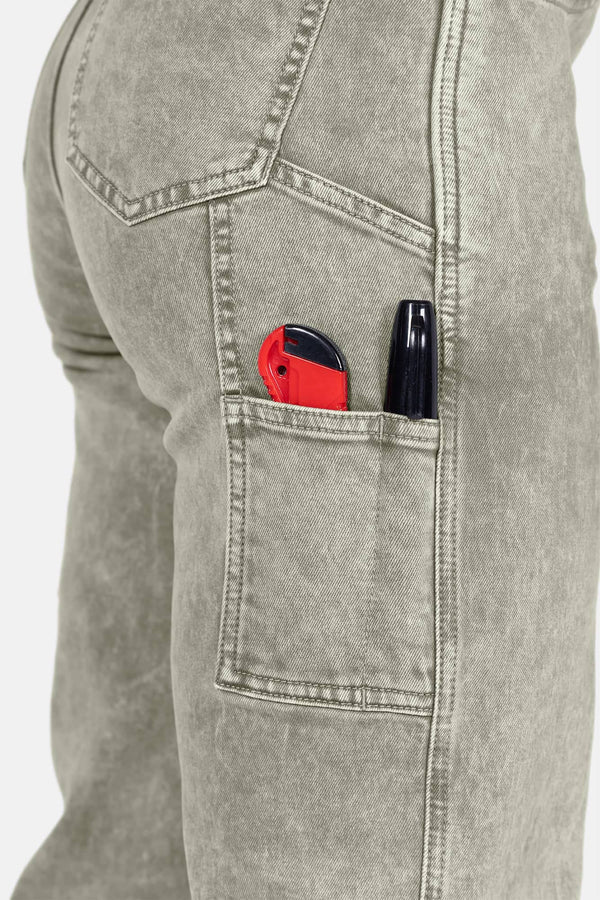 Detail shot of the Old School Wide Leg Mineral Wash Jeans by Dovetail Workwear showing nested side pockets and tool loop with items inside