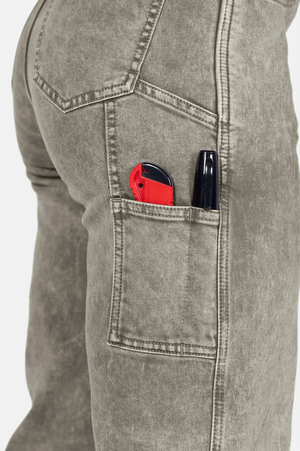 Close-up of the Old School Wide Leg Mineral Wash Jeans in Sunbaked Eucalyptus by Dovetail Workwear, showing nested side pocket with phone pocket and tool loop details