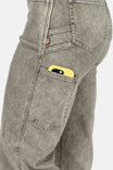 Detail shot of the Old School Wide Leg Mineral Wash Jeans in Sunbaked Eucalyptus by Dovetail Workwear, showing a yellow tool in the nested side pocket
