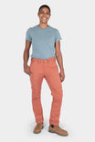 Woman wearing Dovetail Workwear GO TO™ Pants in Terracotta with articulated knees and tool loop, paired with a blue t-shirt and tan boots