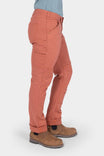 Side view of a woman wearing Dovetail Workwear GO TO™ Pants in Terracotta with visible tool loop, nested pockets, and reinforced knee, paired with brown boots