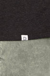 Detail shot of the Dovetail Workwear GO TO™ Crew Neck Tee Shirt showing the brand label at the seam between Black and Agave Green fabric