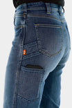 Side view of a woman wearing Dovetail Workwear Old School Wide Leg Jeans in Classic Indigo Blue, showcasing the thigh phone pocket and nested thigh pockets
