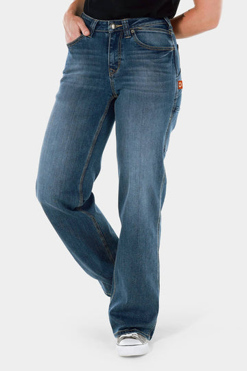 Dovetail Workwear Old School Wide Leg Jeans in Classic Indigo Blue shown on a woman wearing a black top and white sneakers, featuring a relaxed wide leg silhouette