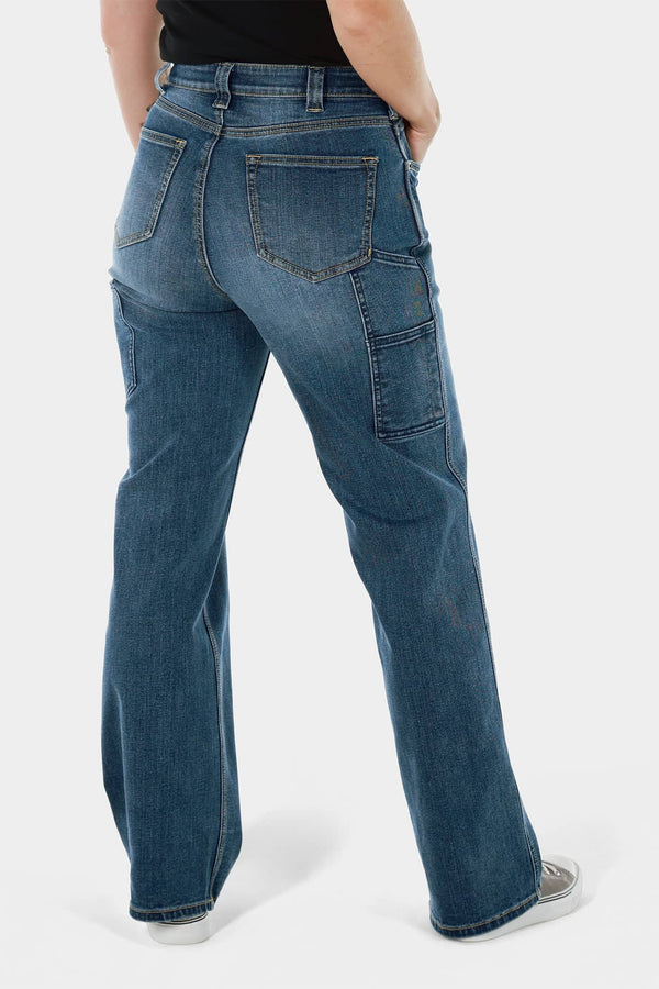Back view of a woman wearing Dovetail Workwear's Old School Wide Leg Jeans in Classic Indigo Blue, showcasing the high-rise fit, nested thigh pockets, and wide leg silhouette