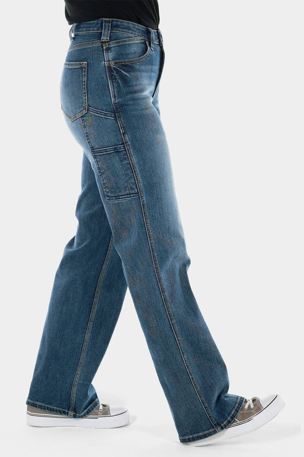 Side view of a woman wearing Dovetail Workwear's Old School Wide Leg Jeans in Classic Indigo Blue, showcasing the wide leg silhouette, high-rise fit, and thigh pocket detail