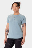 Shore Blue Old School Summer Henley Shirt from Dovetail Workwear shown on a woman, featuring a lightweight cotton blend waffle knit fabric, button-front placket, and short sleeves