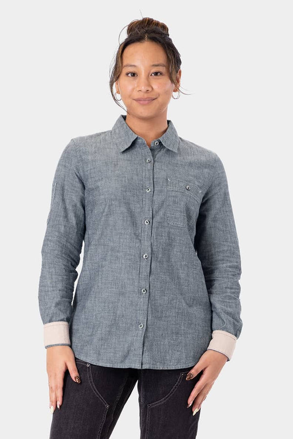 Dovetail Workwear's Givens Long Sleeve Summer Work Shirt in Indigo Blue, featuring UPF 50 sun protection, button chest pocket, and pencil pocket on sleeve, worn by a woman in a front-facing pose