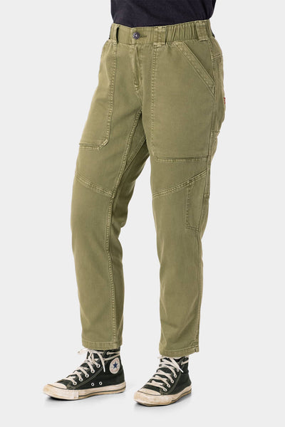 Range Crop Pant in Kelp Green by Dovetail Workwear displayed on a woman wearing black sneakers, showcasing the relaxed leg fit and bellowed front pocket details