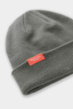 Detail view of the Dovetail Beanie from Dovetail Workwear, showing the soft acrylic knit and woven logo label on the cuff
