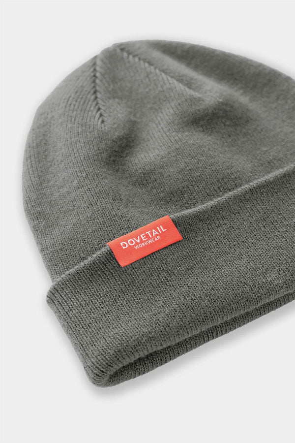 Detail view of the Dovetail Beanie from Dovetail Workwear, showing the soft acrylic knit and woven logo label on the cuff