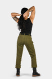 Back view of a woman wearing Dovetail Workwear's GO TO™ Stretch Canvas Pant in Kelp Green, showing the rolled cuffs and tool loop detail