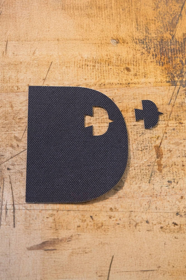 Black Denim Pocket Patch from Dovetail Workwear x NoSo DIY Repair Patches displayed with additional patch variants