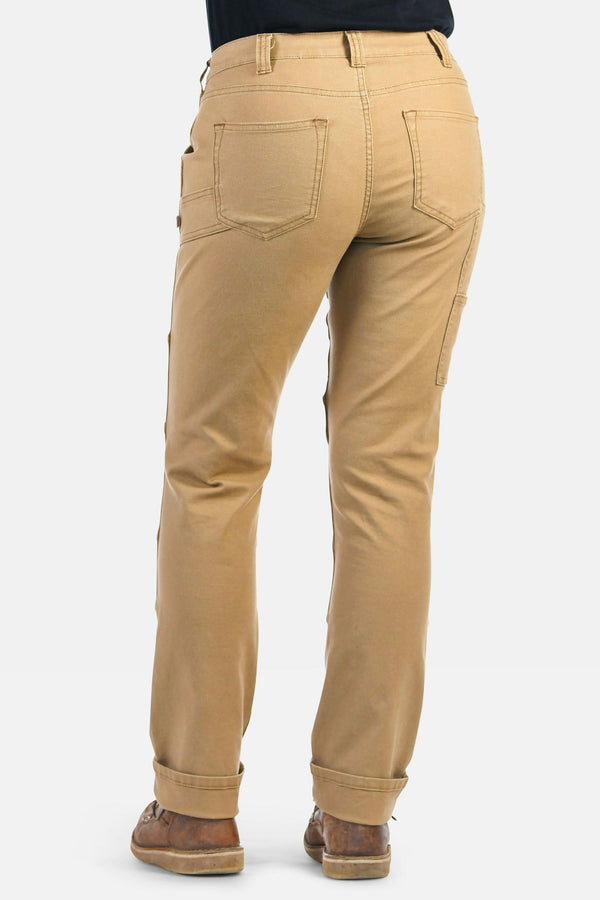 Back view of a woman wearing Dovetail Workwear GO TO™ Stretch Canvas Pant in Sawdust Brown, showing nested pockets and rolled cuffs