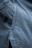 Detail shot of the John Deere X Dovetail Workwear Cultivator Work Shirt in indigo blue dobby, highlighting the reinforced elbows and textured fabric with UPF 50+ sun protection.