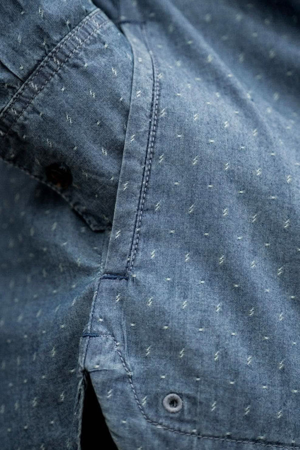 Detail shot of the John Deere X Dovetail Workwear Cultivator Work Shirt in indigo blue dobby, highlighting the reinforced elbows and textured fabric with UPF 50+ sun protection.