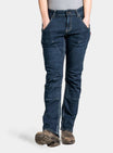 Back view of a woman wearing Dovetail Workwear Britt X Pant Power Hemp in Indigo, featuring reinforced knees and nested pockets, paired with work boots