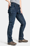 Side view of a woman wearing the Dovetail Workwear Britt X Pant Power Hemp in Indigo, showcasing cargo-style pockets, reinforced knees, and straight leg construction